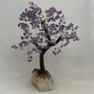 One Amethyst Indian Tree - large tree with purple stone leaves, brown branches, and a white rock base - on a white background