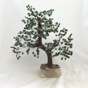 One Aventurine Indian Tree - large tree with green stone leaves, brown branches, and a white rock base - on a white background