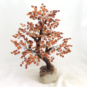 One Carnelian Indian Tree - large tree with orange stone leaves, brown branches, and a white rock base - on a white background
