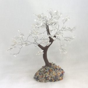One Rock Crystal Indian Tree - large tree with transparent stone leaves, brown branches, and a white rock base - on a white background