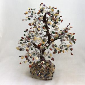 One Rainbow Indian Tree - large tree with multi coloured stone leaves, brown branches, and a white rock base - on a white background