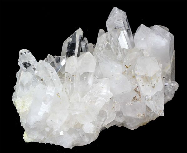 One Rock Crystal Cluster - transparent points with a white opaque base - on a black background