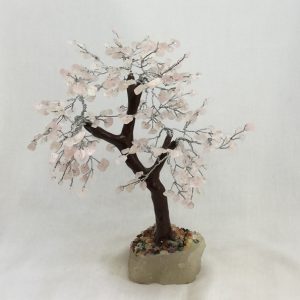 One Rose Quartz Indian Tree - large tree with pink stone leaves, brown branches, and a white rock base - on a white background