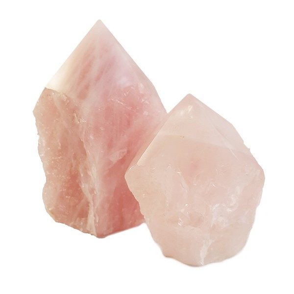 Two descending sizes of Rose Quartz Cut Points - soft pink points - on a white background