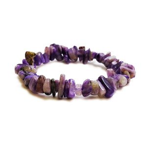Side view of Charoite A Chip Bracelet - light and dark purple chips - on a white background