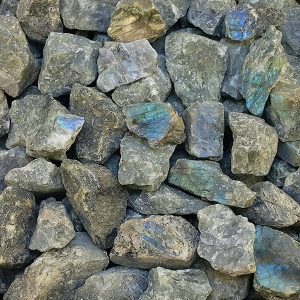 Close up of Rough Labradorite Rock - grey, green, blue and gold rocks.