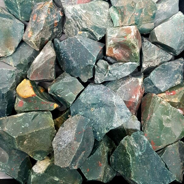 Close up of Bloodstone Rough Rock - green with red and yellow flecks.