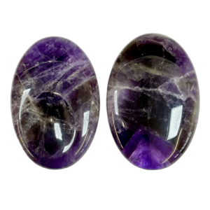 Two Banded Amethyst Thumb Stones - purple with white banding - on a white background