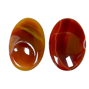 Two Carnelian Thumb Stones - red with orange and cream banding - on a white background