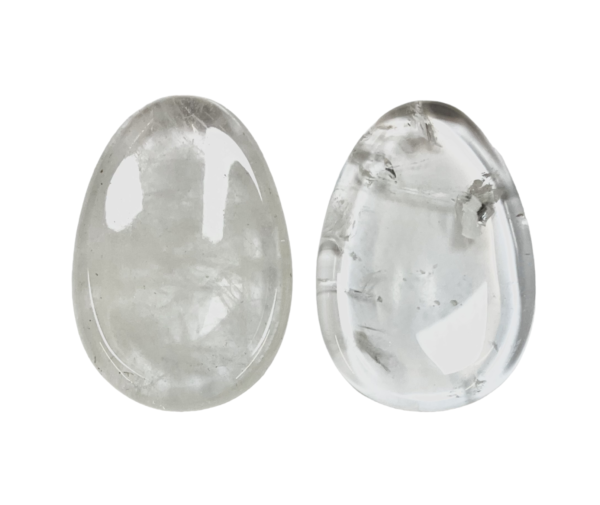 Two Crystal Worry Stones - clear with some inclusions - on a white background