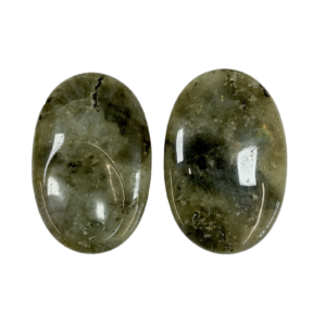 Two Labradorite Thumb Stones - green with areas of rainbow - on a white background