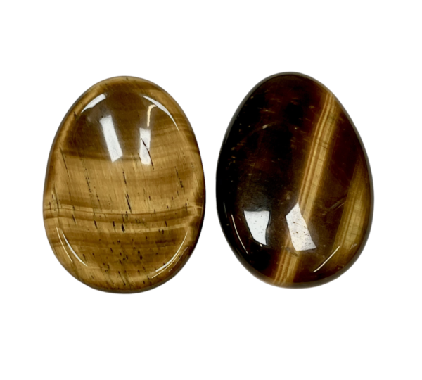 Two Tiger Eye Worry Stones - brown with gold banding - on a white background
