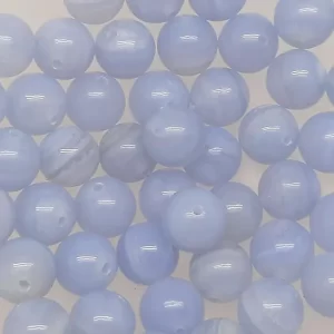 Close up of Agate (Blue Lace) Round Beads - light blue with grey banding coloured spheres.