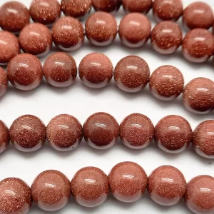 Close up of Goldstone Round Beads - brown with copper flecks coloured spheres.