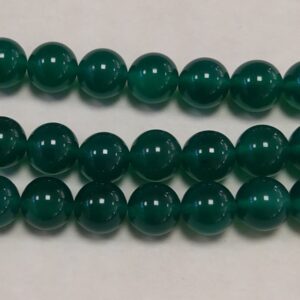 Close up of Agate (Green) Round Beads - dark green coloured spheres.