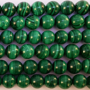 Close up of Malachite Round Beads - green with dark green stripes coloured spheres.