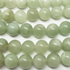 Close up of Jade Round Beads - lime green coloured spheres.