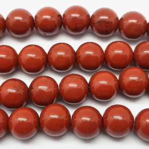 Close up of Red Jasper Round Beads - red coloured spheres.