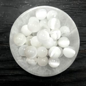 White Selenite tumbled stones in a selenite bowl