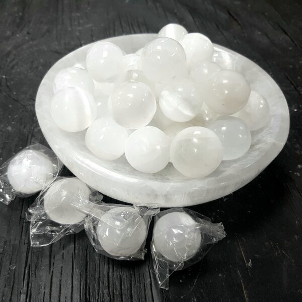 White Selenite tumbled stones in a selenite bowl