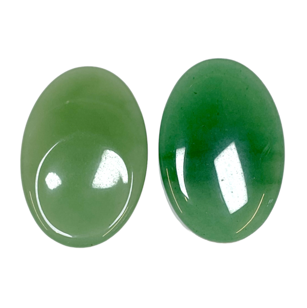 Two Aventurine Thumb Stones - green with sparkling flecks - on a white background