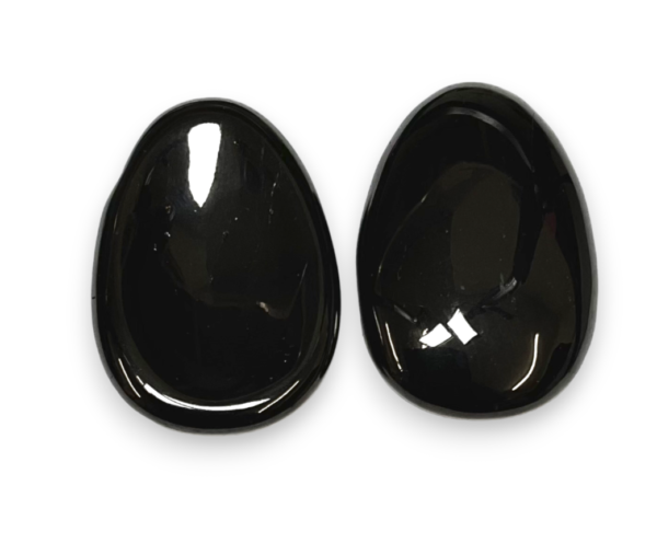 Two Jet Worry Stones - black with sheen - on a white background