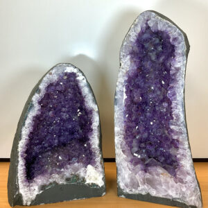 Two Amethyst Caves - purple semi circular druzes set into concrete