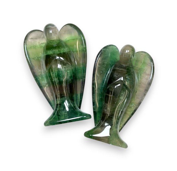 Two Fluorite Angels Large viewed from behind - translucent green with bands of various shade - on a white background
