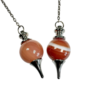 Example of two Carnelian Ball Pendulums - 20mm orange and red sphere in a silver holder - on a silver chain, on a white background
