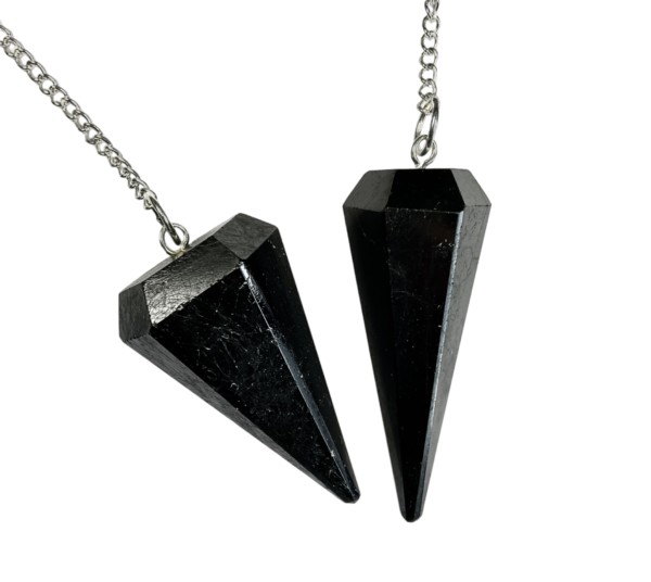 Example of Black Tourmaline Pendulums - black with small rough/white inclusions - on a silver chain, on a white background