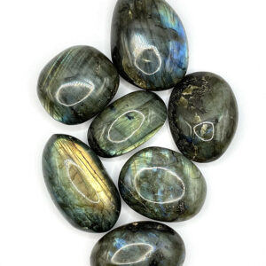 Group of Labradorite Pebbles (green and grey with a bright blue or rainbow flash), or banding) on a white background