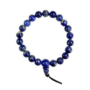 One Lapis power bracelet viewed from the top - blue with hint of gold round beads with one larger bead - on a white background