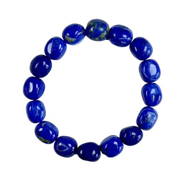 One Lapis nugget bracelet from the side - large blue and gold beads - on a white background