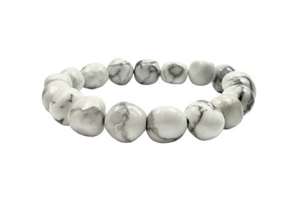 One Howlite nugget bracelet from the side - large white beads with black veining - on a white background