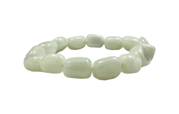 One Opalite nugget bracelet from the side - large pearlescent white beads - on a white background