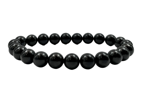 One 8mm round bead Shungite bracelet from the side - small black metallic beads - on a white background
