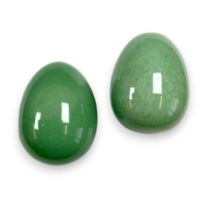 Two Aventurine eggs - green stone - on a white background