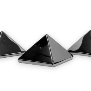 Three Haematine pyramids - metallic chrome finish - on a white background