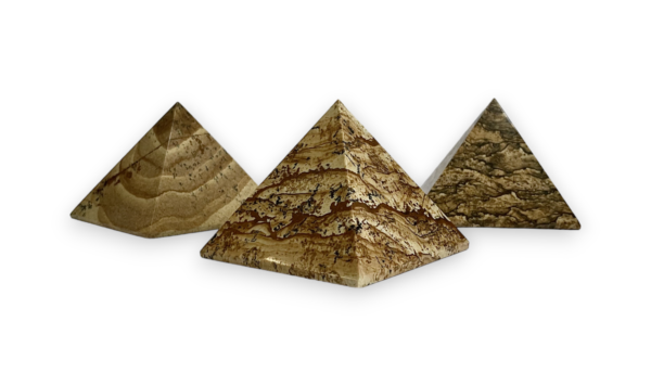 Three KPS pyramids - beige with black veining - on a white background