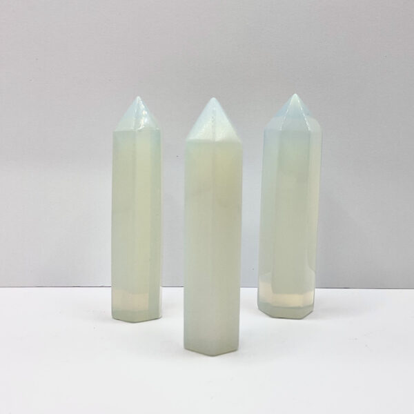 three polished points in an ascending line - pearlescent blue glass opalite - on a white background