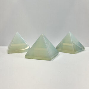 Three Opalite pyramids - pearlescent opal finish - on a white background