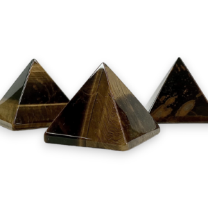 Three Tigers Eye pyramids - black, brown and gold banding - on a white background