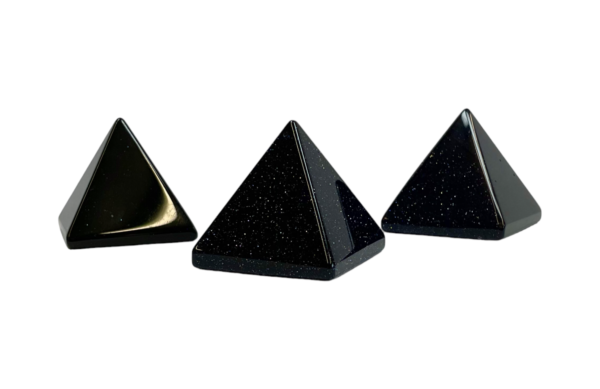 Three Blue Goldstone pyramids - dark bluestone with copper flecks - on a white background