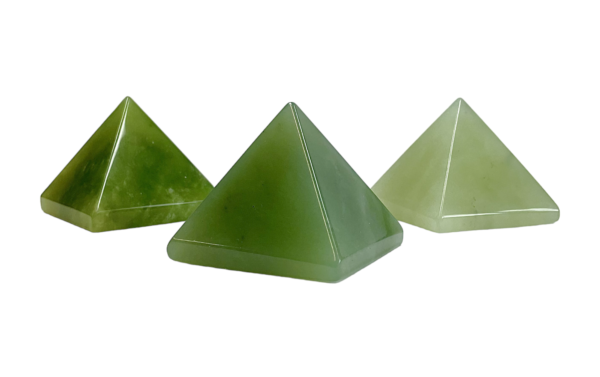 Three Jade pyramids - light green to dark green - on a white background