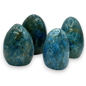 Group of domed freeforms - deep blue with dark blue veining and flecks apatite - on a white background