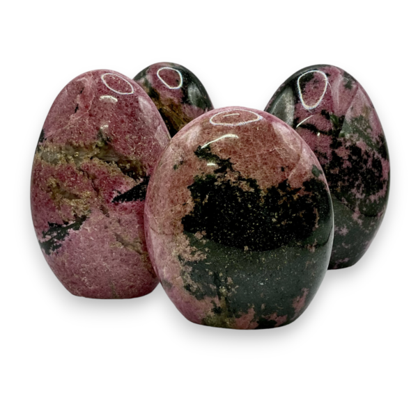 Group of domed freeforms - dark pink with black areas rhodonite - on a white background