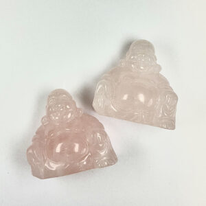 Two buddhas - pink rose quartz - on a white background