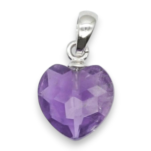 Two amethyst heart pendants - purple stone cut into a faceted shape on a silver chain - on a white background.