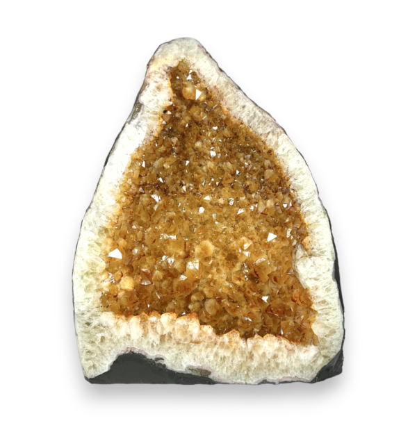 Citrine Cave (1) shown from the side - half of a giant geode with orange points - on a white background