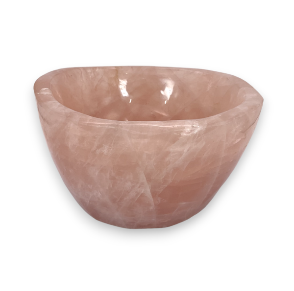 One Rose Quartz Bowl (D) from the side - pale pink extra large bowl with some translucent and orange areas - on a white background